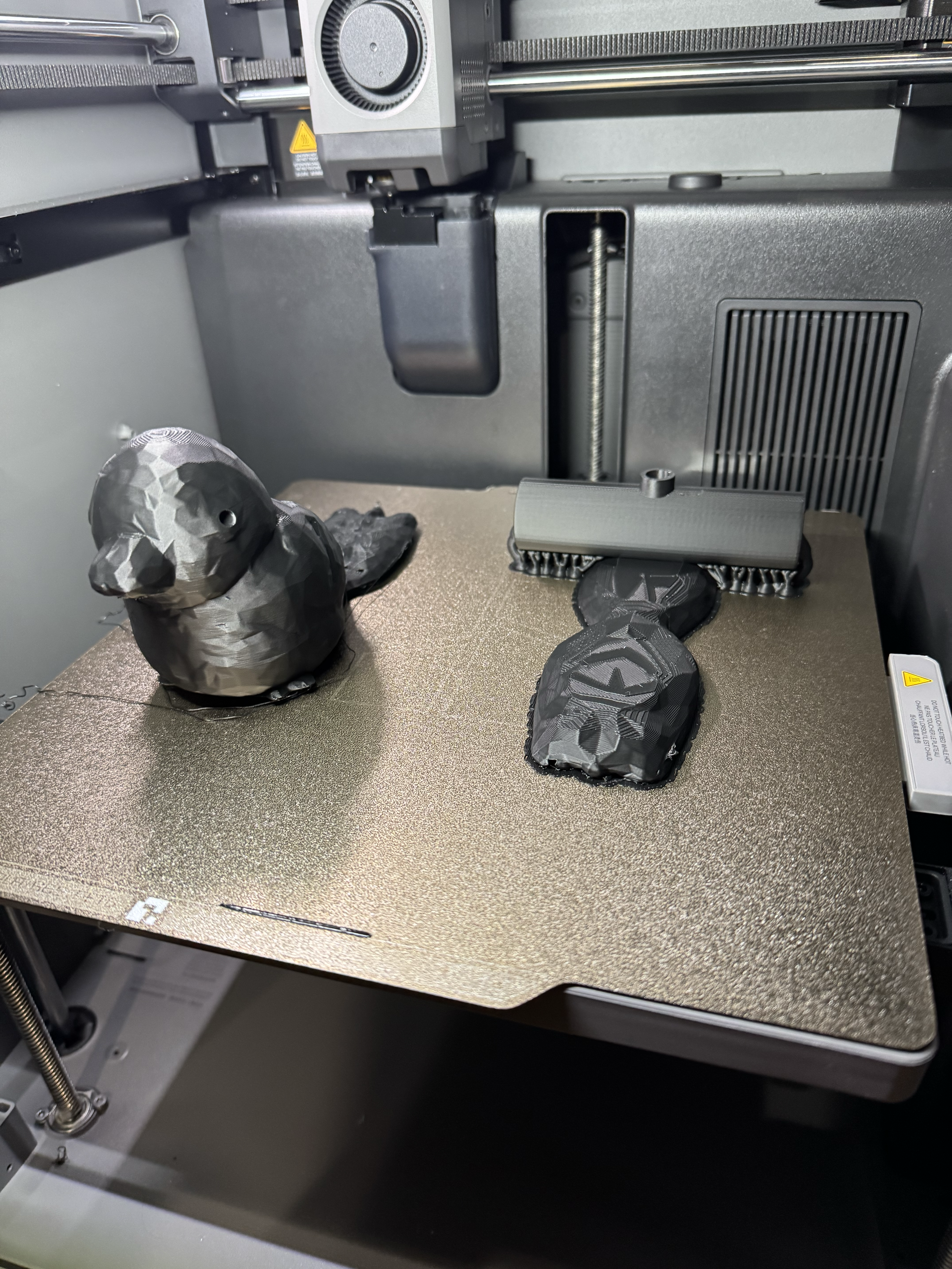 Another iteration of bird prints on the build plate, shape improving